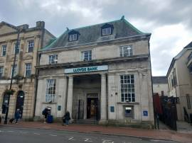 NEATH TOWN CENTRE - PROMINENT AND IMPRESSIVE, STONE FRONTED INVESTMENT PROPERTY LET TO HIGH STREET BANK WITH A YIELD OF 8.47%